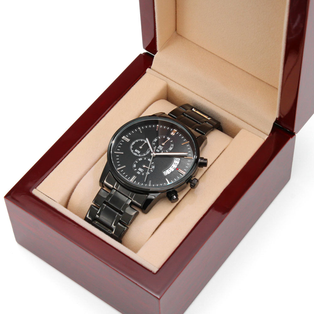 engraved black chronograph watch elegantly displayed in a gift box, showcasing its sophisticated design.